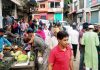 People shopping in Bhaderwah town during relaxation of curfew on Sunday.