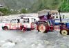 A tractor trying to pull out a Tata Sumo struck in Shadole nallah in Tehsil Mahore of Reasi district.