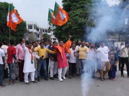 J&K BJP chief Ravinder Raina and other leaders celebrating party's victory by bursting crackers and dancing outside party headquarters at Trikuta Nagar in Jammu on Thursday. — Excelsior/Rakesh