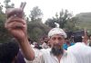 A protestor showing gun rounds fired by police in Gursai area of Mendhar in District Poonch.