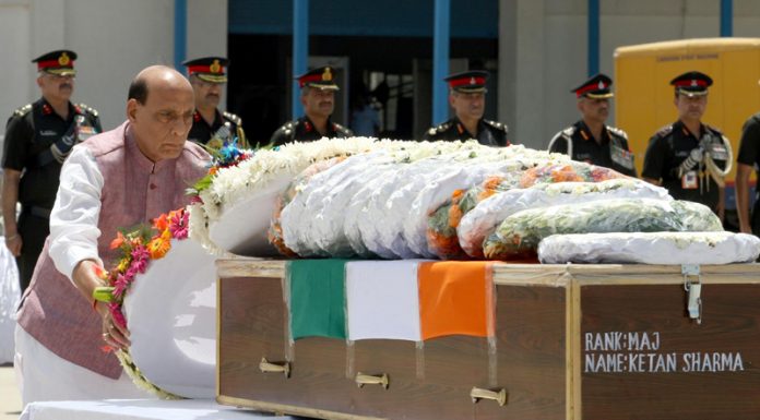 Defence Minister Rajnath Singh laying wreath on the mortal remains of Major Ketan Sharma at Palam Technical Area in New Delhi on Tuesday. (UNI)