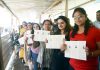 Pilgrims show their registration slips at Baltal base camp on Sunday. —Excelsior/Shakeel