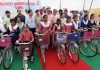 Principal Secretary Industries Navin Choudhary giving bicycles to BPL girls at Samba.