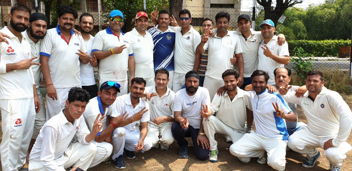 Players of JU and JK Media XI posing for a group photograph after the match.