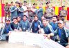 Commandar Drass Warriors, Brigadier V Ganapathy presenting T20 title trophy to NSC Bhimbat at Drass in Kargil. -Excelsior/Basharat Ladakhi