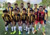 Young Footballers posing for group photograph after scripting win in State Football League.
