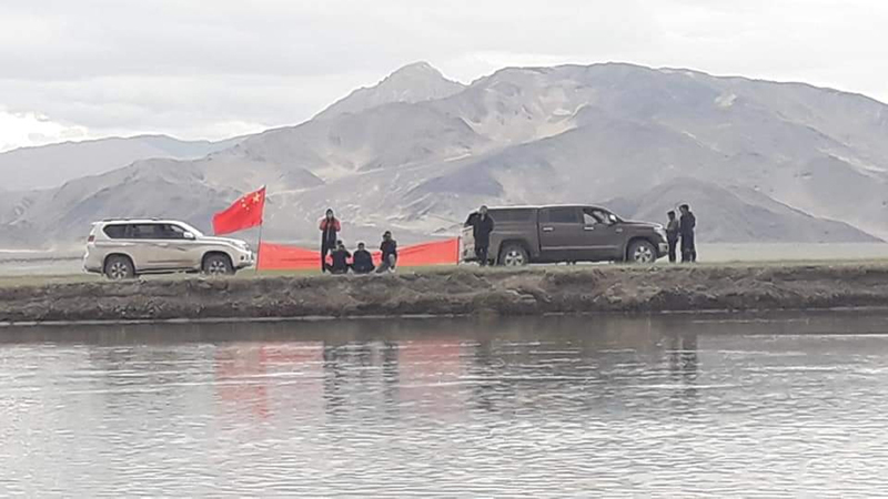 Chinese troops in civil dresses with their flag across Nullah in Demchok area of Eastern Ladakh sector.