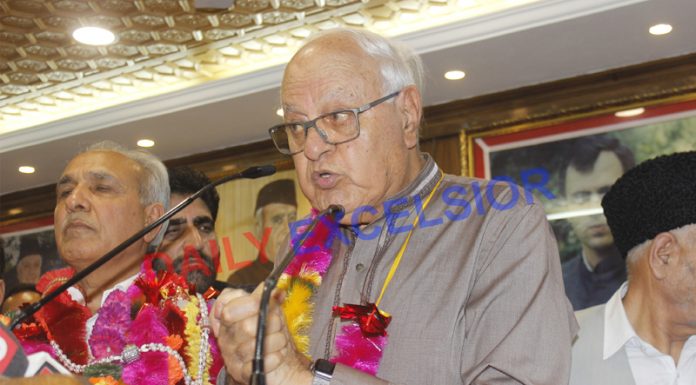 NC president Dr Farooq Abdullah speaking at party headquarters in Srinagar on Sunday. —Excelsior/Shakeel