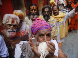 A Swami Amarnath bound Sadhu blowing a conch in front of a registration camp at Jammu on Monday. —Excelsior/Rakesh