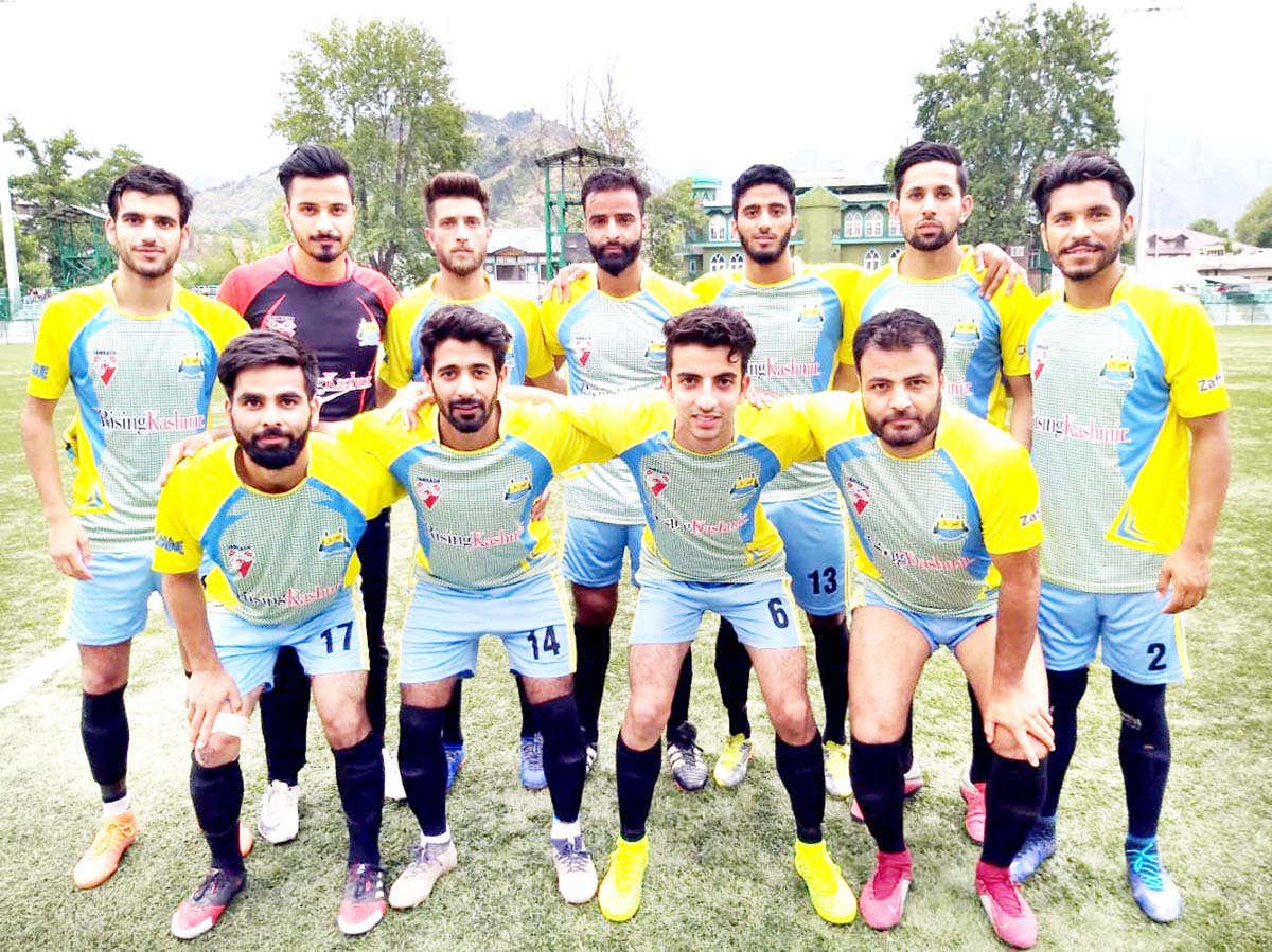 Footballers posing for a group photograph in Srinagar.