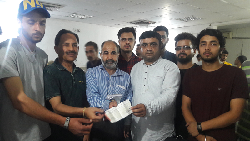 Bharat Sharma staff member of Union Minister, Dr Jitendra Singh’s constituency office handing over a cheque of Rs two lakh to the kin of lone survivor of five member family in Kishtwar mishap at Jammu alongwith secretary Red Cross on Wednesday.
