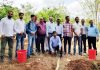 Advisor K Skandan posing with delegation at Tanflora Infrastructure Park in Tamil Nadu.