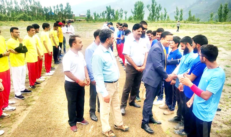 DDC Doda, Dr Sagar Dattaray Doifode interacting with players during the inaugural ceremony of Cricket tournament for visually challenged at Bhaderwah. -Excelsior/Tilak Raj