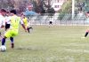 Footballers in action during a match of JKFA Annual League Football Tournament at TRC ground in Srinagar. 