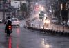 Vehicles move with head lights on as rains lash Jammu city on Wednesday evening. —Excelsior/Rakesh