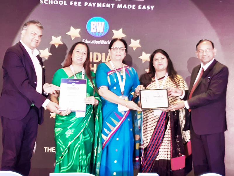 Rohini Aima, Principal, Jammu Sanskriti School, Jammu along with Nidhi Kohli and Varuna Magotra, Pre-Primary and Primary wing Co-ordinators receiving award at Gurgaon in Haryana.