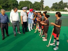 Veteran National Hockey player Dharam Pal Singh interacting with players at KK Hakku Hockey Stadium, Jammu on Tuesday.