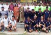 Football teams posing along with dignitaries during closing ceremony of CLUJ Football Tournament in Jammu.