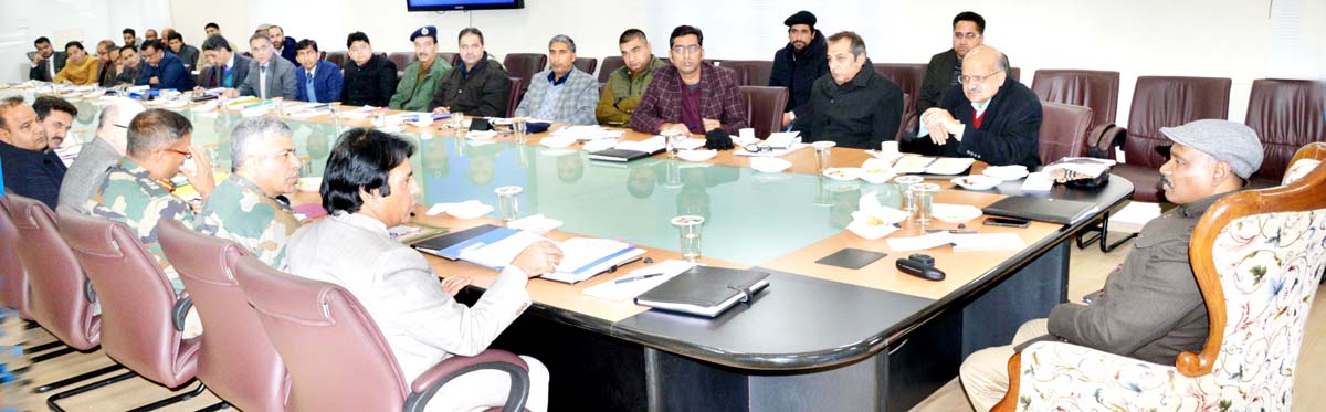 Lieutenant Governor chairing meeting of officers in Srinagar on Monday.
