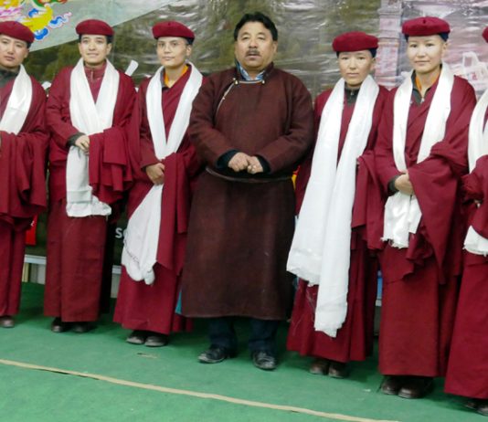 Kung Fu Nuns posing for group photograph with Hill Council Chairman Gyal P Wangyal during felicitation event at Leh. -Excelsior/Morup Stanzin