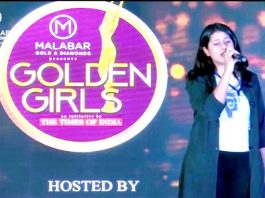 Akshita displaying singing skills during 'Golden Girls Hunt' event at Jain University in Bengaluru.