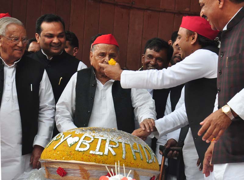 Samajwadi Party president Akhilesh Yadav with other party leaders celebrating the birthday of party founder Mulayam Singh Yadav at party office in Lucknow on Friday. (UNI)