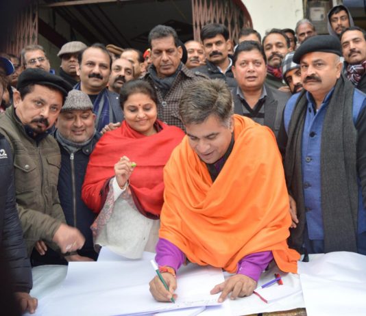 BJP president, Ravinder Raina during a signature campaign on CAA at Jammu on Monday.