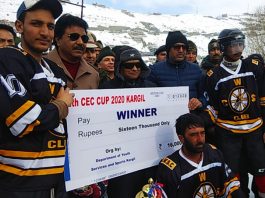 Winners of 12th CEC Ice Hockey Tournament posing alongwith LG Ladakh, R K Mathur on Friday. —Excelsior/Basharat Ladakhi