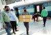Boxes of masks being unloaded from special parcel van at Jammu Railway Station on Friday. -Excelsior/Rakesh