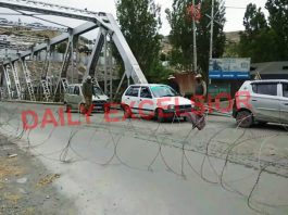 Kargil town being fenced again following re-imposition of lockdown like restrictions in Ladakh on Saturday. -Excelsior/Basharat Ladakhi