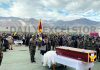 BJP national general secretary Ram Madhav, Army Commanders and others paying tributes to Indian Army's Tibetan brave heart, JCO Nyima Tenzin at Leh on Monday. -Excelsior/Morup Stanzin