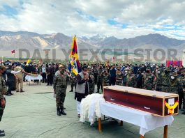 BJP national general secretary Ram Madhav, Army Commanders and others paying tributes to Indian Army's Tibetan brave heart, JCO Nyima Tenzin at Leh on Monday. -Excelsior/Morup Stanzin