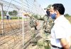 DC Kathua, OP Bhagat along with BSF officer supervising cultivation of land across fencing in border belt of Hiranagar sector in Kathua district on Tuesday. -Excelsior/Pardeep