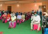 Lieutenant Governor Manoj Sinha interacting with residents of Jagti migrant township on Monday.