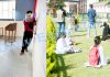 A few students attending optional classes as schools re-open in Jammu (left) and Srinagar (right) on Monday.— Excelsior pics by Rakesh & Shakeel