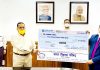 Union Minister Dr Jitendra Singh receiving a cheque as contribution to the PM CARES Fund from national level delegation of Bharat Vikas Parishad (BVP), at New Delhi.