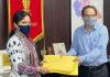Deputy Commissioner Jammu handing over domicile certificates to Director Postal Services.