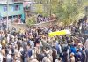 Large number of people participating in funeral procession of youth BJP leader in Kulgam on Friday. -Excelsior/ Sajad Dar