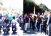 BJYM activists taking out bike rally in Jammu (left) and BJP rally in Srinagar (right) to celebrate Accession Day on Monday. -Excelsior Pics by Rakesh & Shakeel