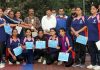 Winning players posing for a group photograph with dignitaries at Jammu.