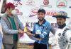 Dr TK Moza presenting man of the match award to Akash Raina at MA Stadium in Jammu.