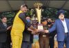 Dignitaries presenting trophy to winning team captain at Jammu.