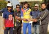 Dignitaries presenting trophy to a player after the match at KC Sports Club Ground Jammu.