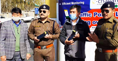 Officers of Traffic Police Leh launching e-challaning on Sunday. —Excelsior/Basharat Ladakhi