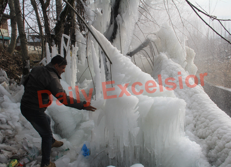 A man near frozen water body in Budgam district of Kashmir. —Excelsior/Aabid Nabi