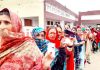 A long queue of voters in front of a polling booth in Swankha DDC constituency on Monday. -Excelsior/Badyal