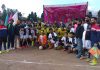 Dignitaries and players posing for a group photograph at Sports Stadium Poonch.