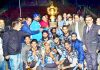 Jubilant KC Young Strikers team posing for a group photograph while receiving trophy from Mayor at MA Stadium Jammu.