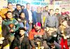 Players and dignitaries posing for a group photograph along with their trophies during Powerlifting Championship at Jammu.