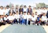 Winning team and dignitaries posing for a group photograph at Jammu.